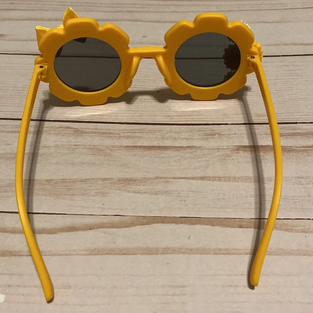Girls yellow flower shaped sunglasses